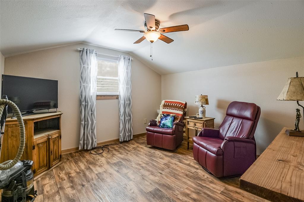 2683 Bells Chapel Road Palmer, TX 75152 - Photo 15 of 28 a living room with furniture and a flat screen tv