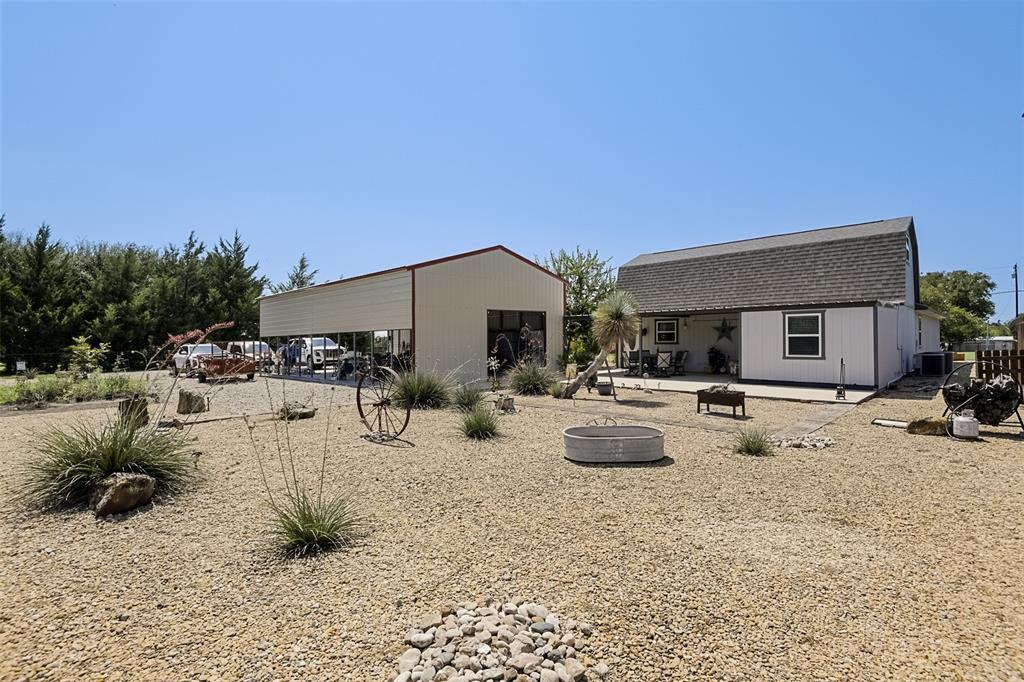 2683 Bells Chapel Road Palmer, TX 75152 - Photo 20 of 28 a view of a backyard with swimming pool and furniture