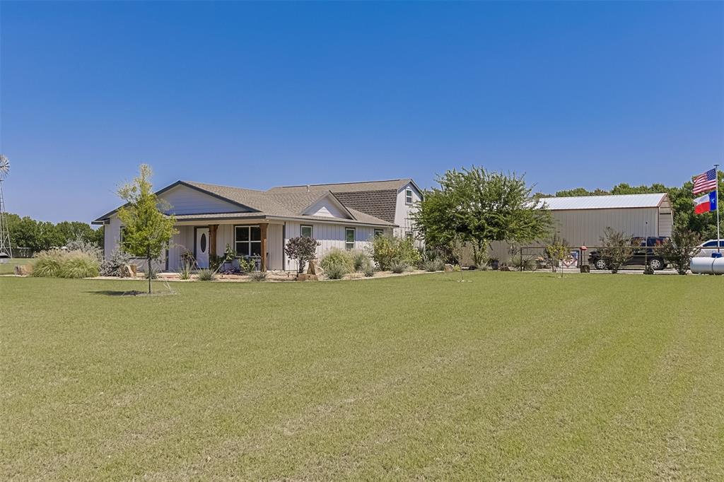 2683 Bells Chapel Road Palmer, TX 75152 - Photo 2 of 28 a front view of house with yard and ocean view