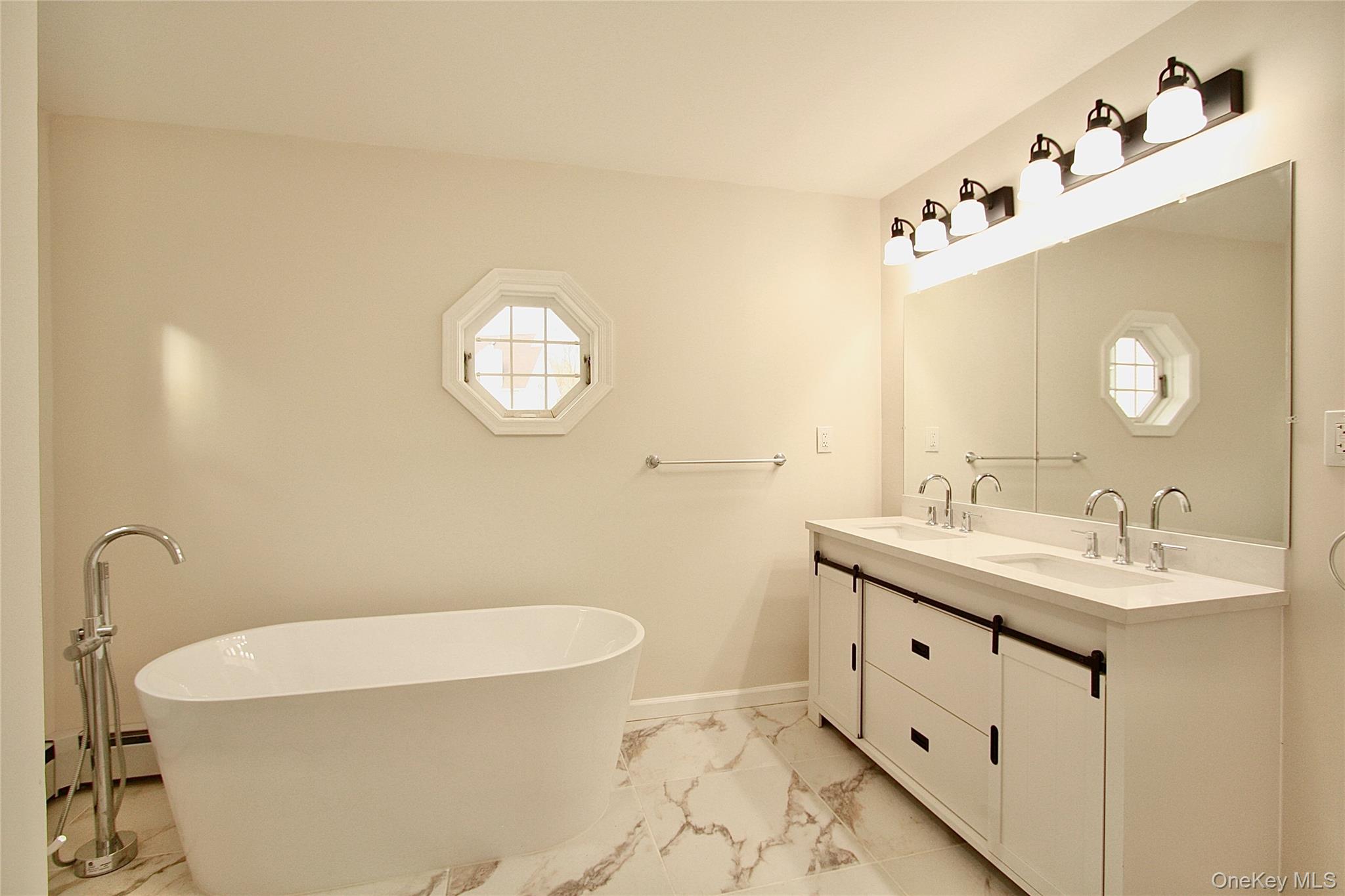 12 Clove Road Salisbury Mills, NY 12577 - Photo 16 of 28 a bathroom with a sink mirror and toilet