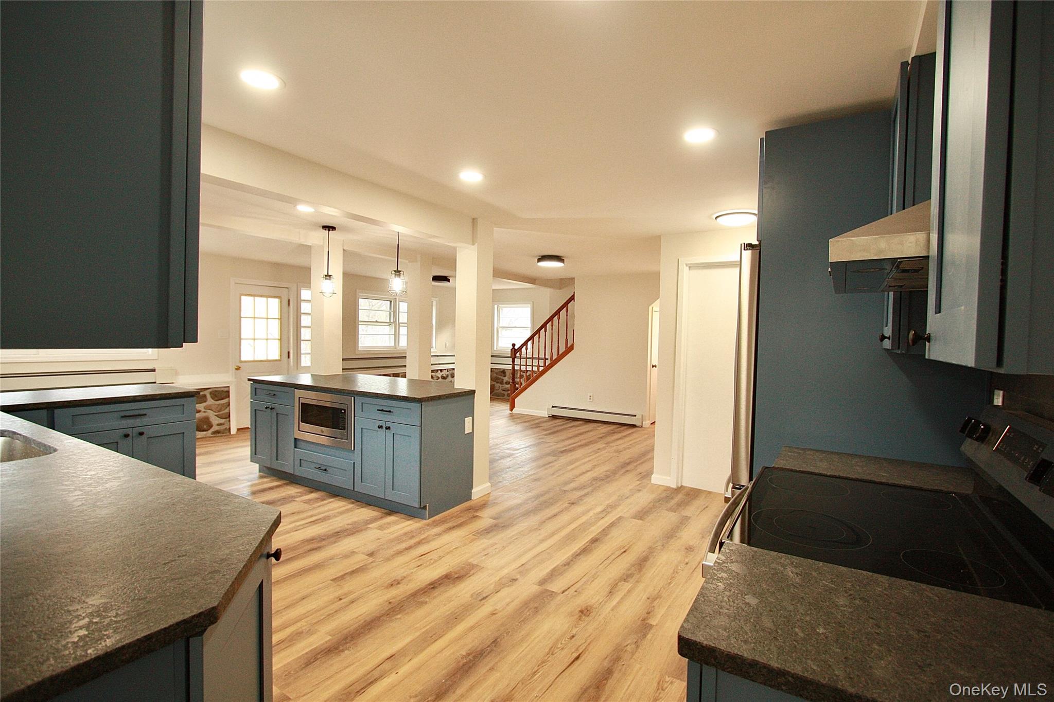 12 Clove Road Salisbury Mills, NY 12577 - Photo 9 of 28 a large kitchen with stainless steel appliances kitchen island granite countertop a large counter top and stove