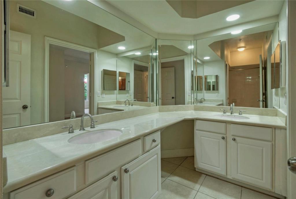 7701 Rialto Boulevard, Unit 1326 Austin, TX 78735 - Photo 8 of 11 a bathroom with a double vanity sink and a mirror