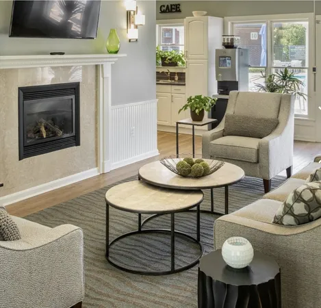 a view of a brick house with large windows and a table