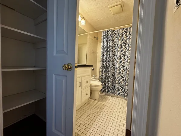 a view of a room with wooden floor and window