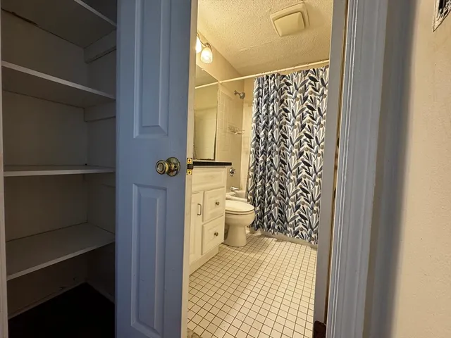 a view of a room with wooden floor and window