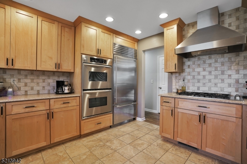 7 Livingston Avenue Warren, NJ 07059 - Photo 1 of 29 a kitchen with cabinets stainless steel appliances and a window