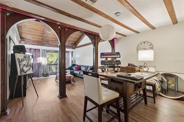 a view of a dining room with furniture window and wooden floor