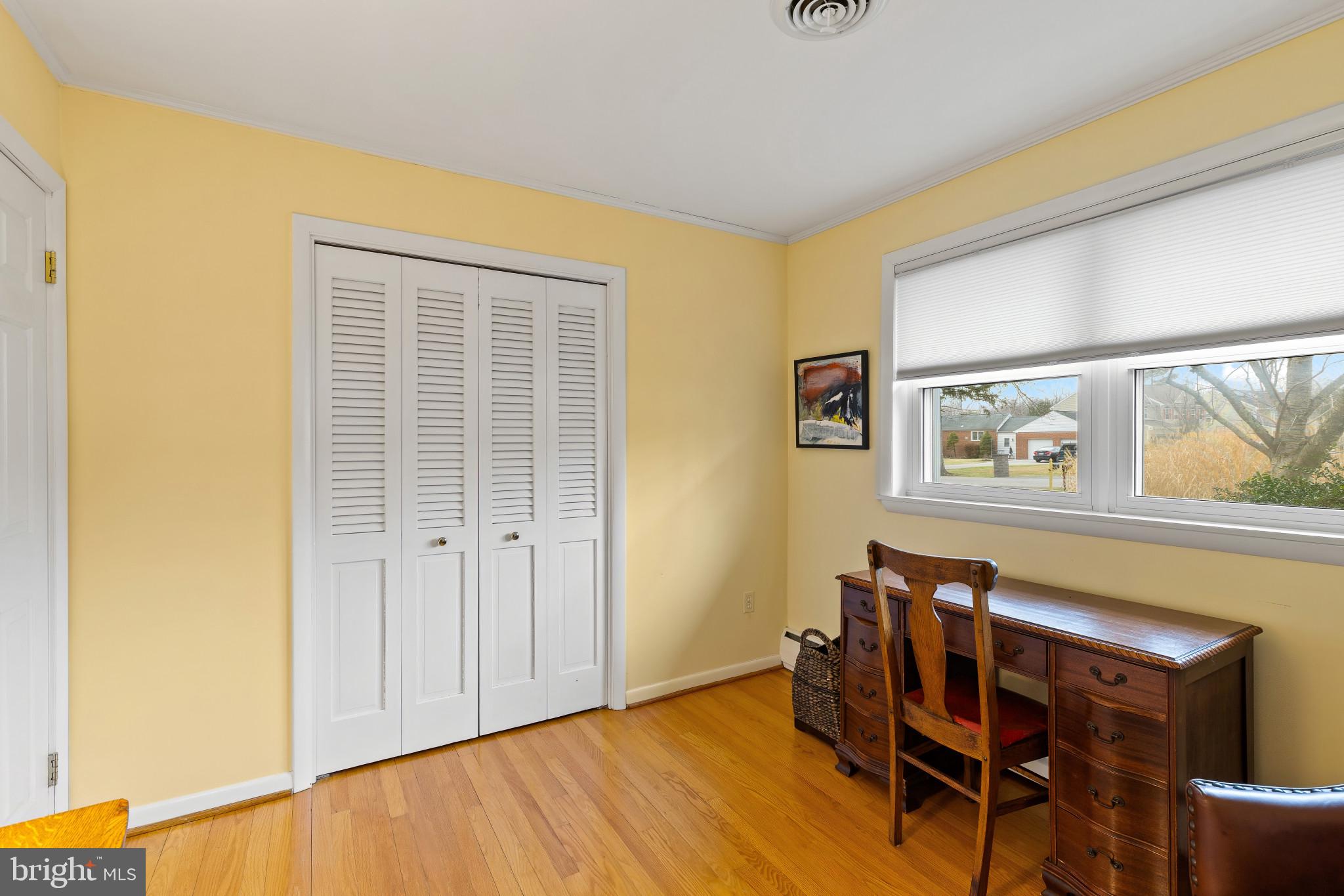 8419 High Ridge Road Ellicott City, MD 21043 - Photo 27 of 49 a view of a dining room with furniture and wooden floor