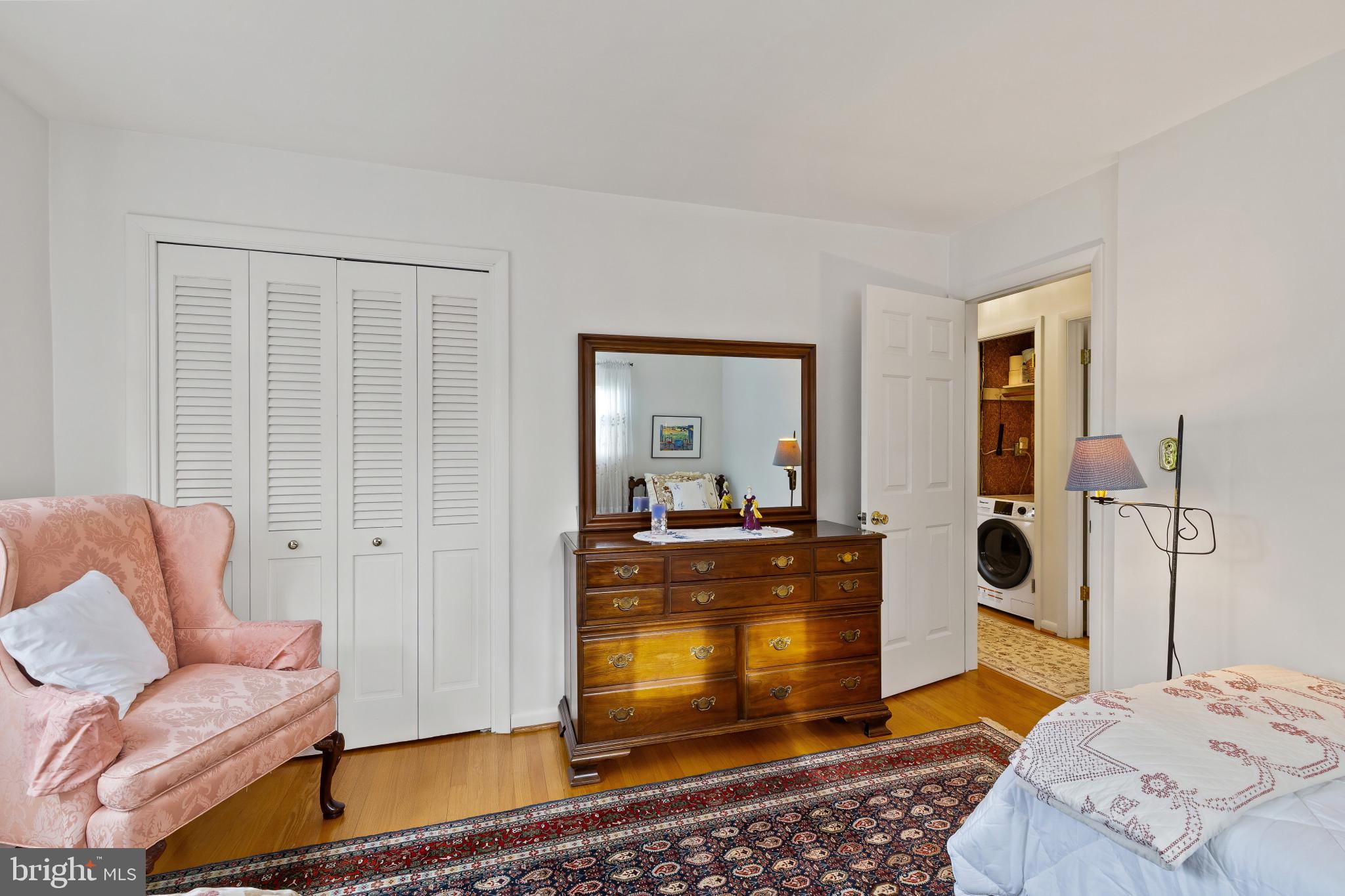 8419 High Ridge Road Ellicott City, MD 21043 - Photo 30 of 49 a bedroom with a bed and wooden floor