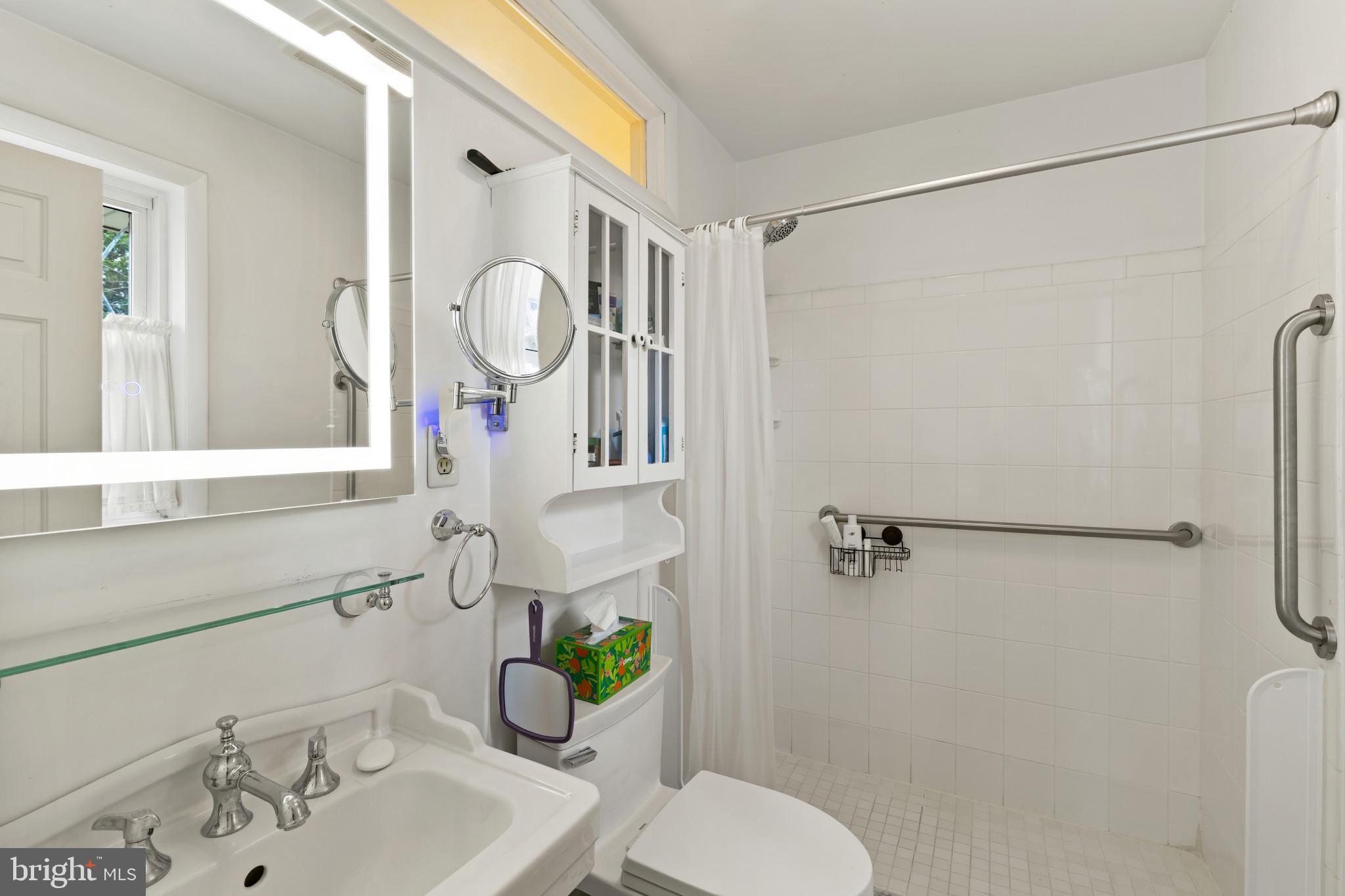 8419 High Ridge Road Ellicott City, MD 21043 - Photo 34 of 49 a bathroom with a sink toilet and shower