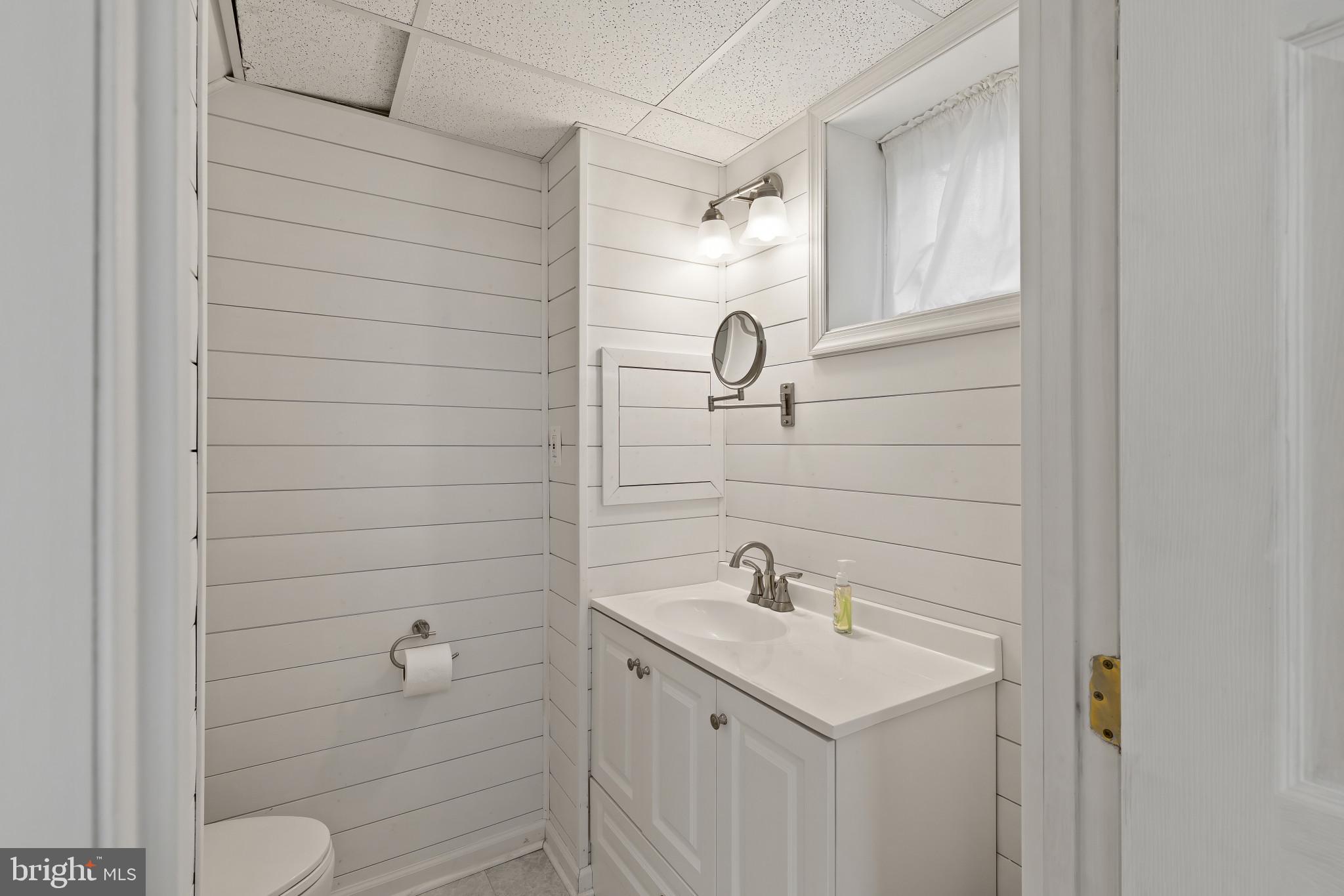 8419 High Ridge Road Ellicott City, MD 21043 - Photo 41 of 49 a bathroom with a sink toilet and vanity