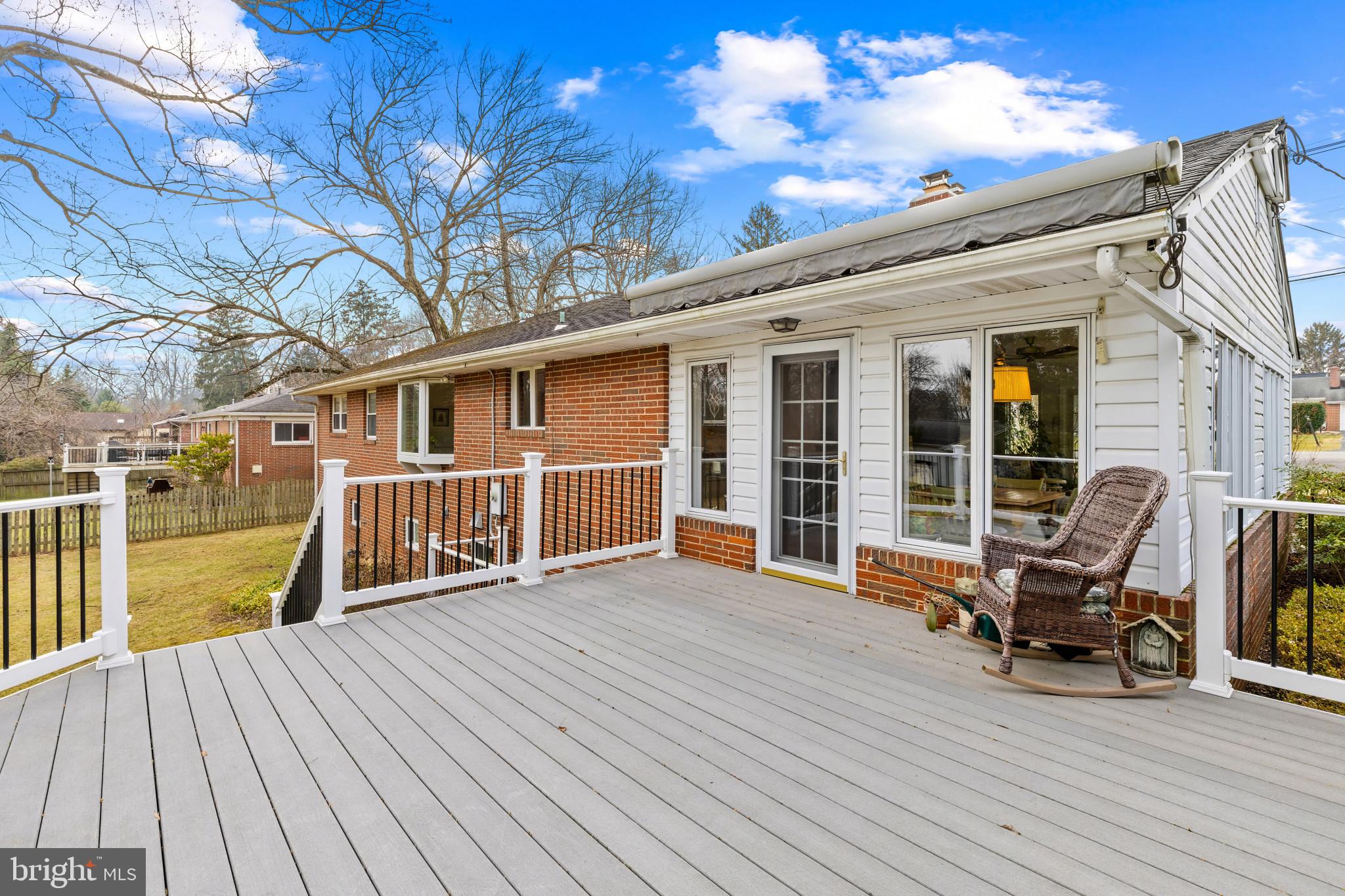 8419 High Ridge Road Ellicott City, MD 21043 - Photo 43 of 49 a view of a deck with wooden floor and seating space