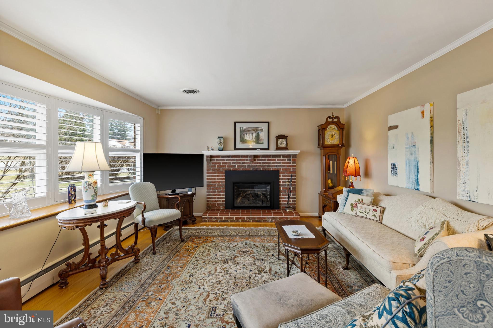 8419 High Ridge Road Ellicott City, MD 21043 - Photo 6 of 49 a living room with furniture and a fireplace