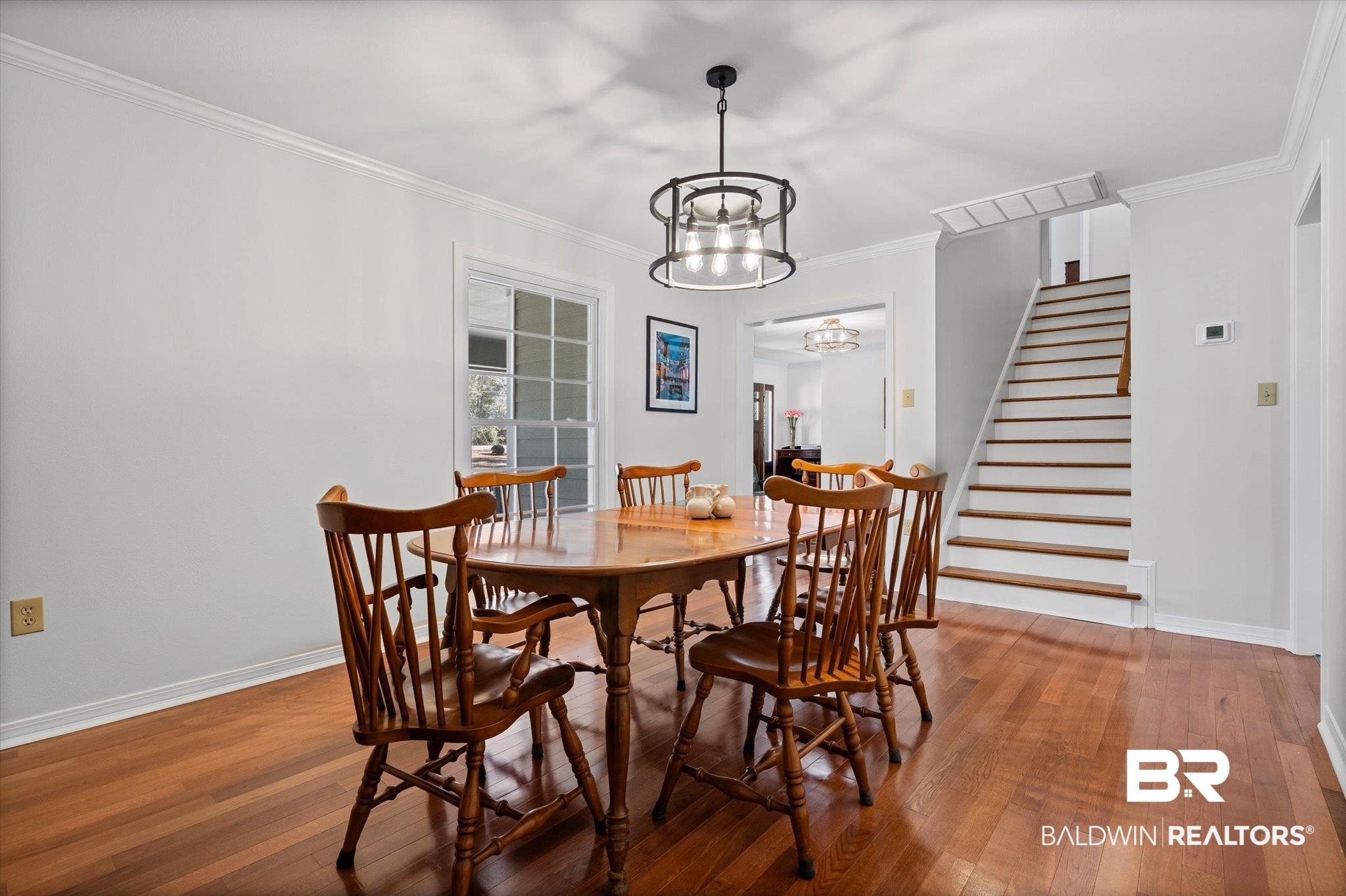 31369 Blakeley Way Daphne, AL 36527 - Photo 4 of 38 Dining space with ornamental molding, hardwood / wood-style floors, and suspended lighting