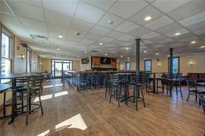 a room with lots of furniture and view of living room