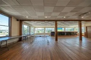 a view of dining room with furniture and wooden floor