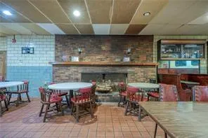 a view of dinning table and chairs in a room