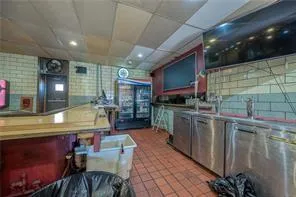 a kitchen with stainless steel appliances granite countertop a sink a stove counter space and cabinets