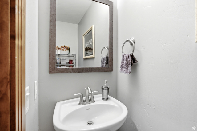 3148 Lower Saddleback Road Park City, UT 84098 - Photo 11 of 67 Pedestal sink with a chrome two-handle faucet, set against light gray walls