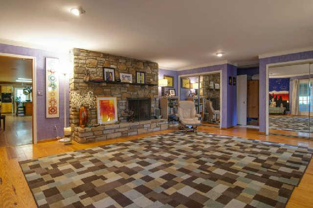 6821 East Plunders Creek Road Dickson, TN 37055 - Photo 14 of 20 a living room with furniture and a fireplace