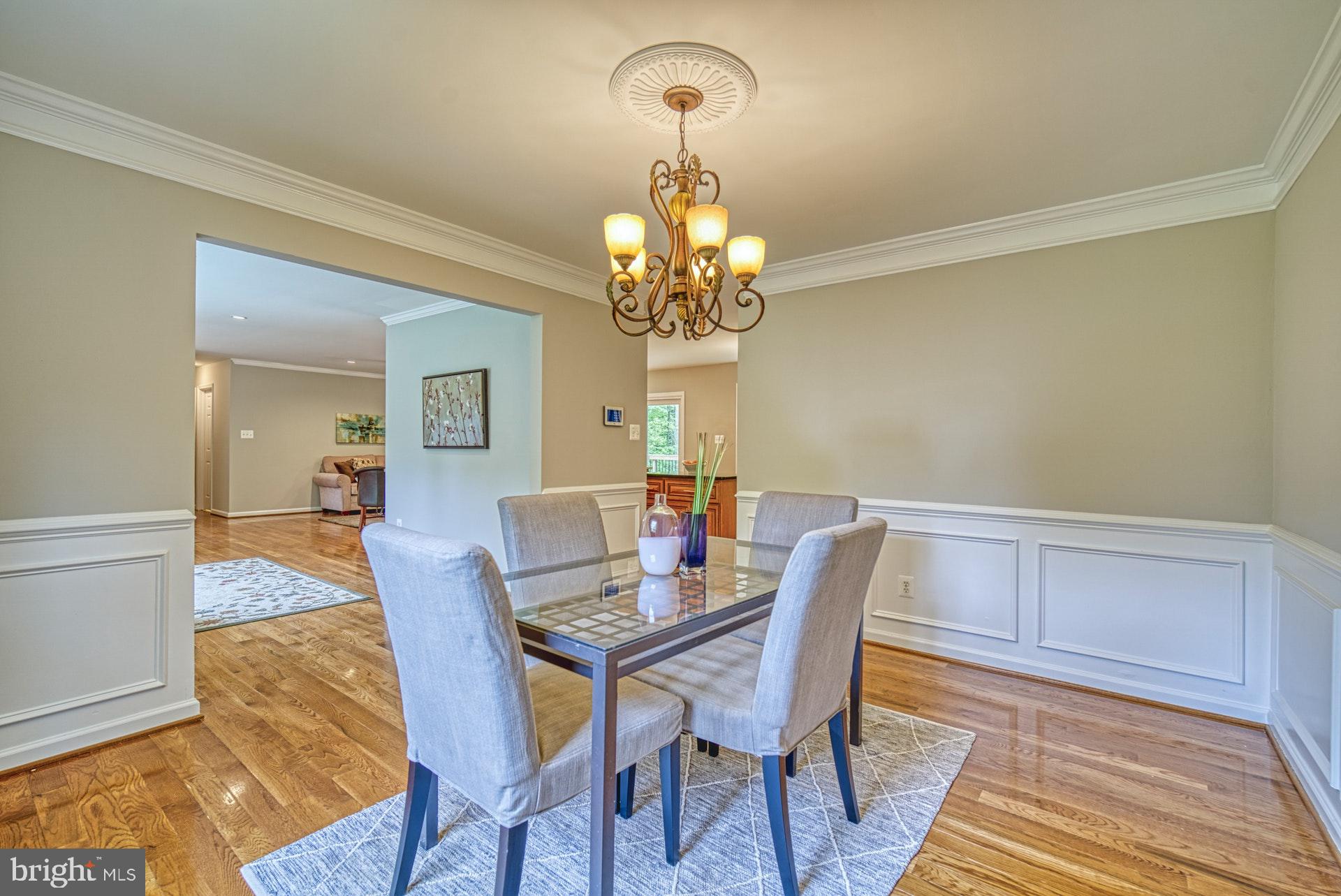 4913 Pheasant Ridge Road Fairfax, VA 22030 - Photo 10 of 33 Formal dining room with boxed trim and crown