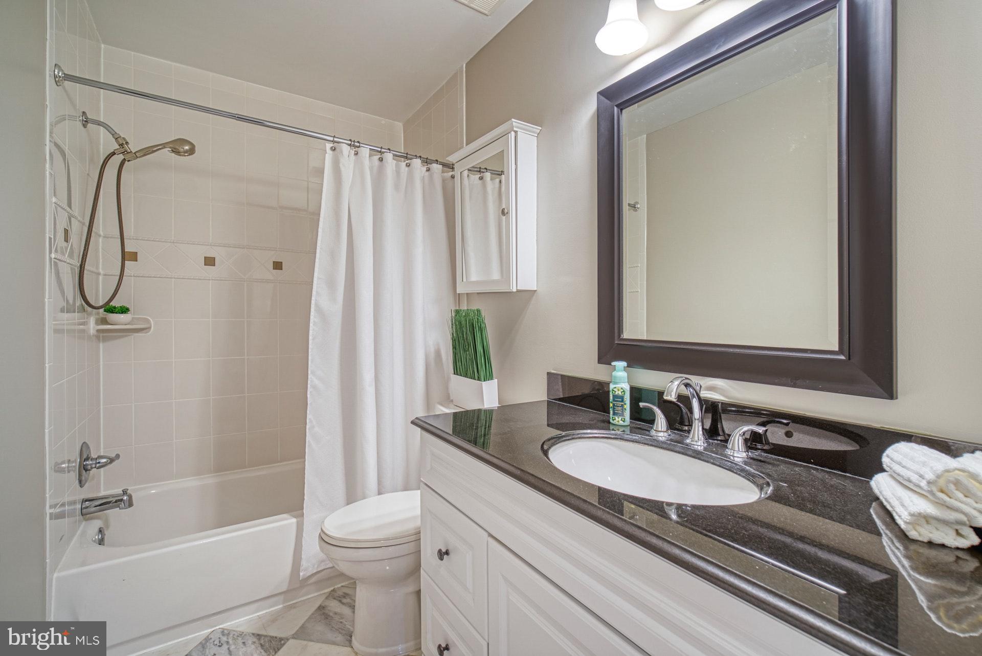 4913 Pheasant Ridge Road Fairfax, VA 22030 - Photo 19 of 33 Updated hall bathroom