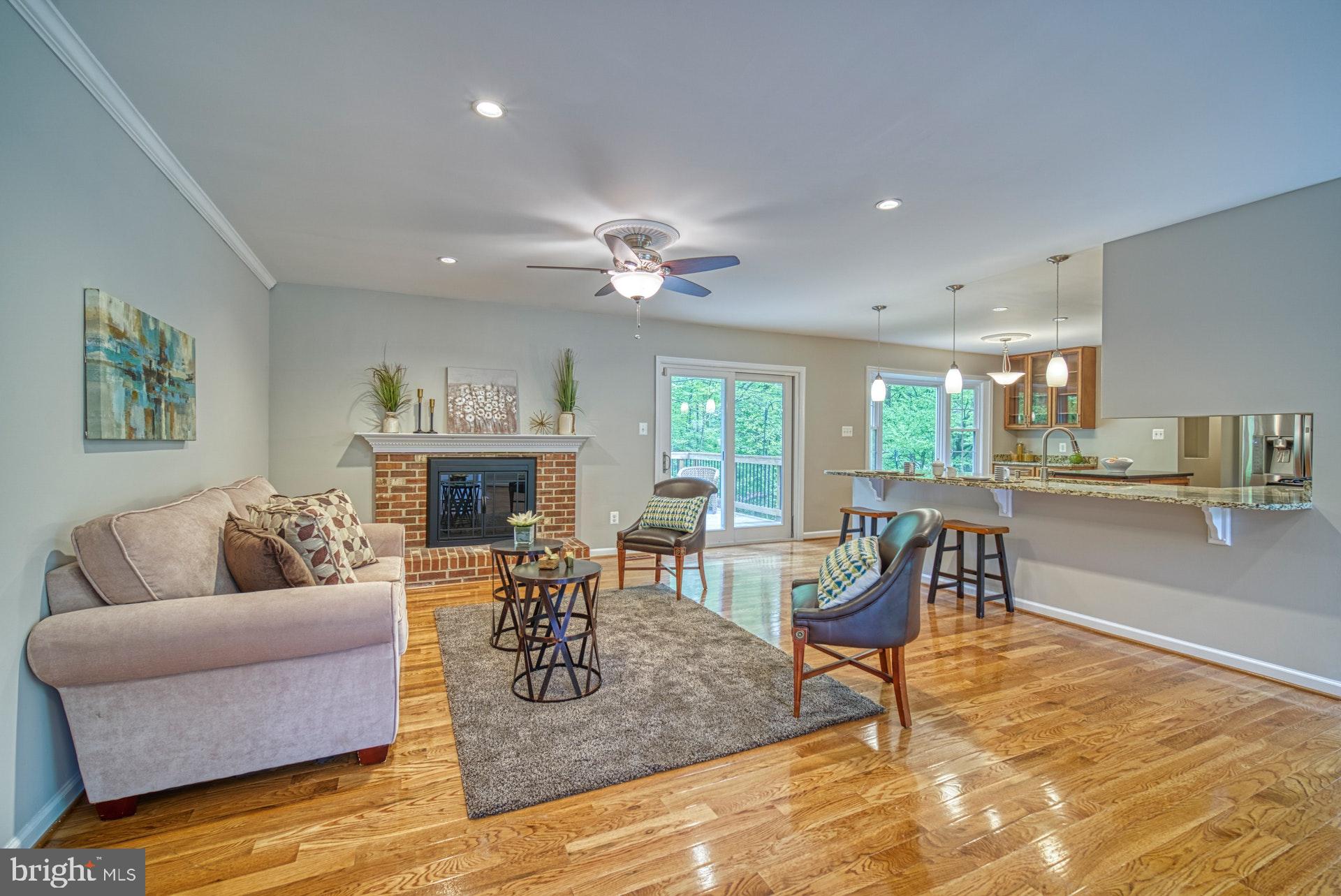 4913 Pheasant Ridge Road Fairfax, VA 22030 - Photo 5 of 33 Gas fireplace and gleaming hardwoods throughout