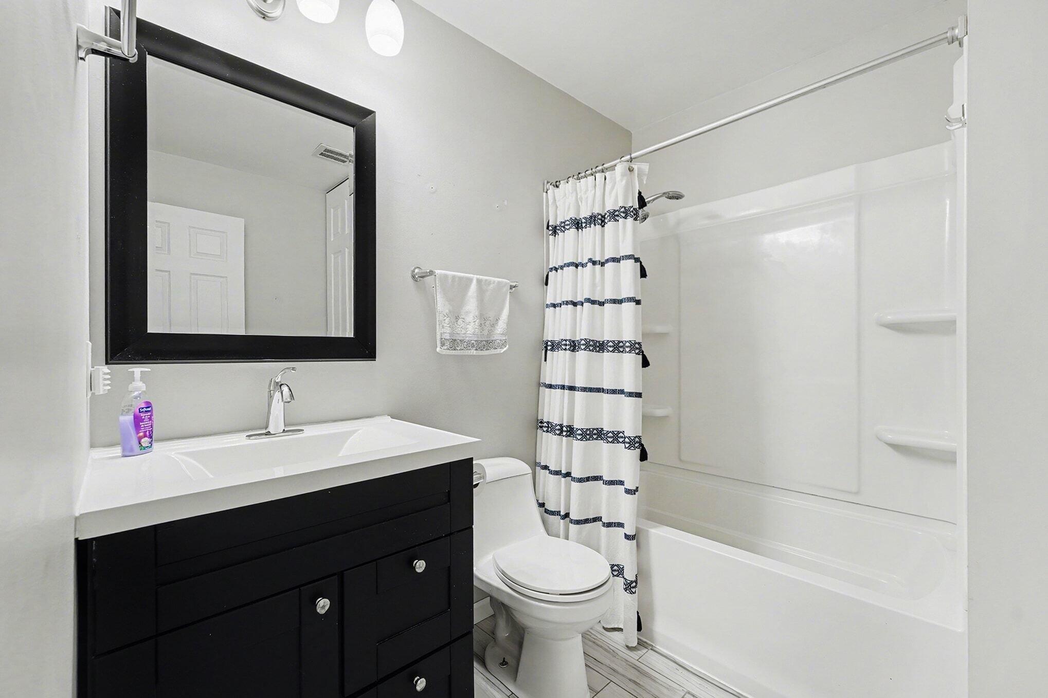 121 North West Street, Unit 22 Crown Point, IN 46307 - Photo 11 of 18 a bathroom with a sink toilet and shower