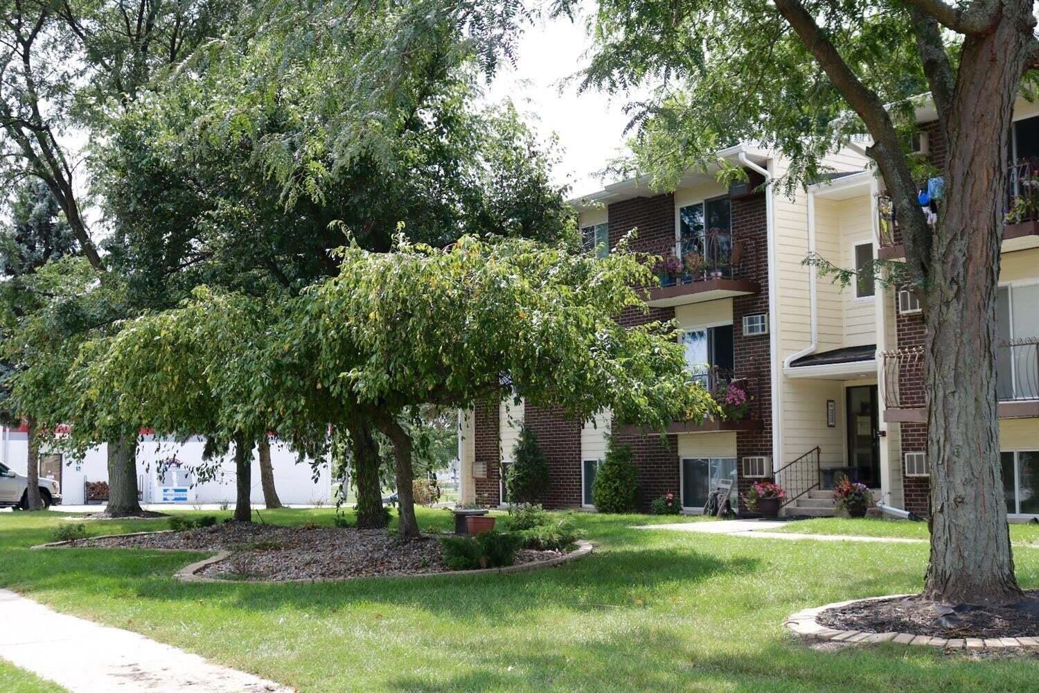 121 North West Street, Unit 22 Crown Point, IN 46307 - Photo 2 of 18 a front view of a house with a garden