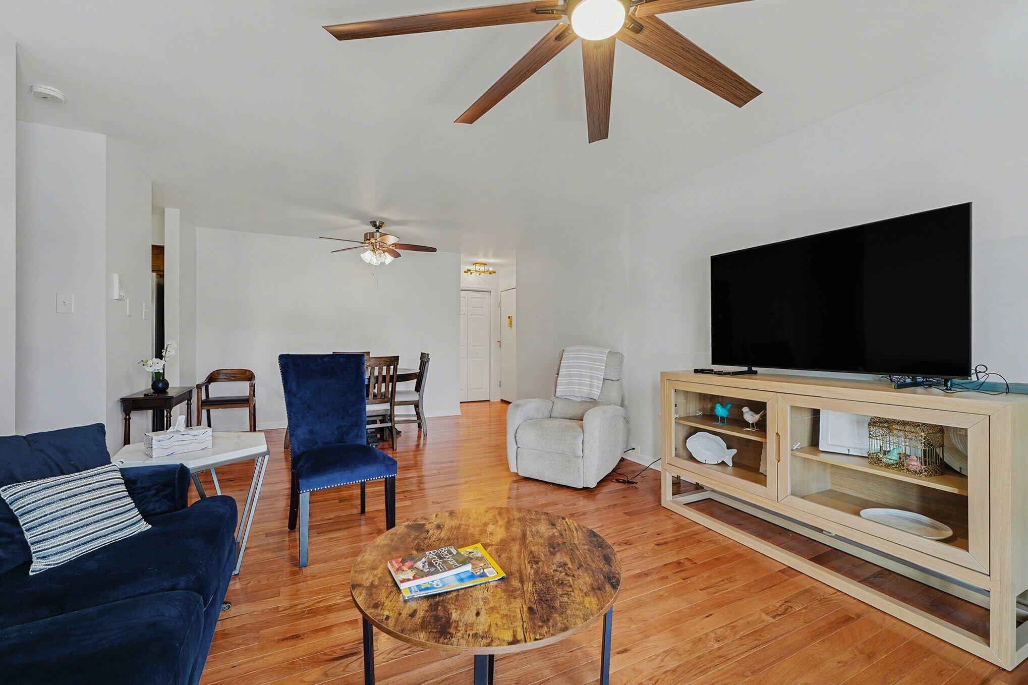 121 North West Street, Unit 22 Crown Point, IN 46307 - Photo 7 of 18 a living room with furniture and a flat screen tv