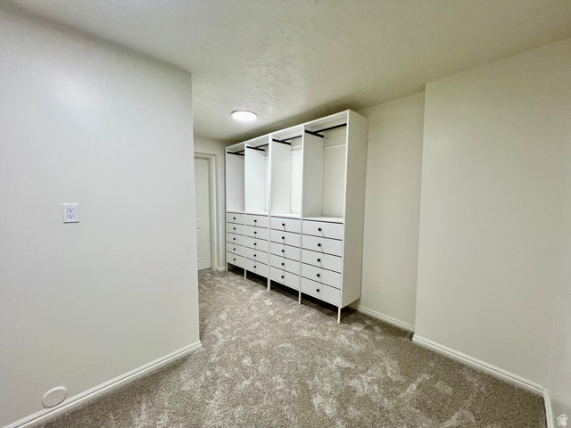 812 East Bates Cyn Road Tooele, UT 84074 - Photo 87 of 144 Built-in closet system featuring multiple drawers and hanging rods