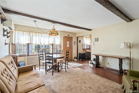 a living room with furniture a window and a table