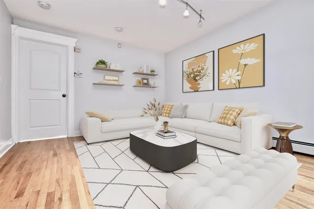 a living room with furniture and a table