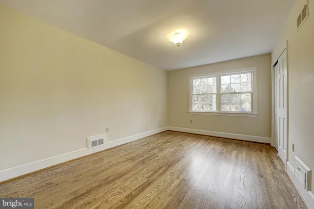 a bathroom with a sink toilet and mirror
