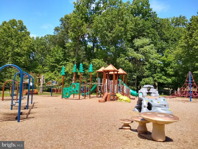 a green sign that is on the side of a building