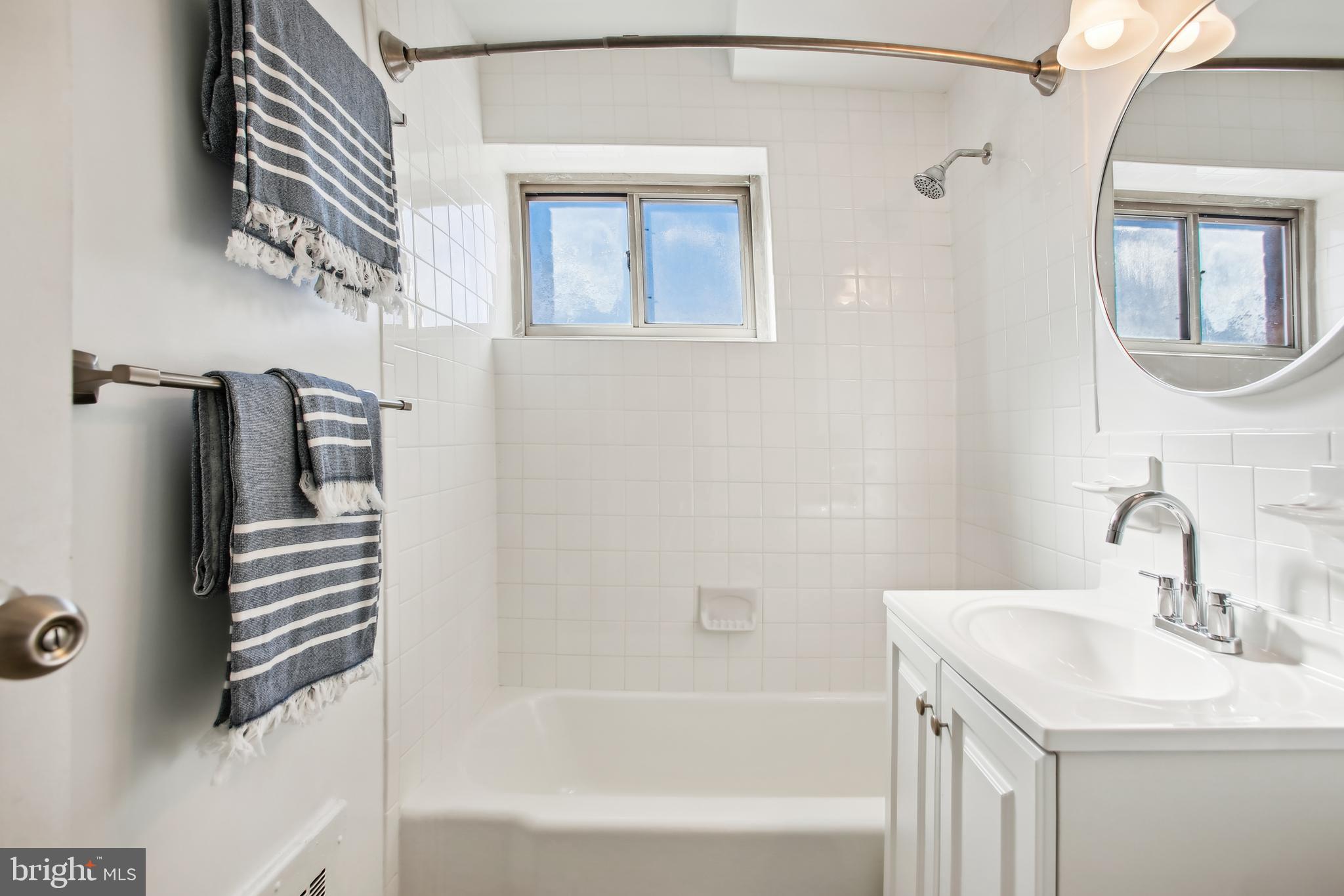 3900 Tunlaw Road Northwest, Unit 420 Washington, DC 20007 - Photo 17 of 34 Fresh and bright bathroom