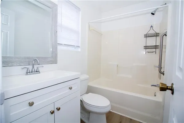 a bathroom with a sink toilet and a bathtub