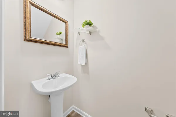 a bathroom with a sink and mirror