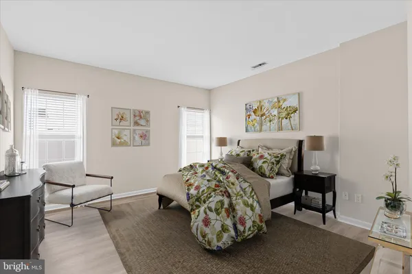 a bedroom with furniture and a window