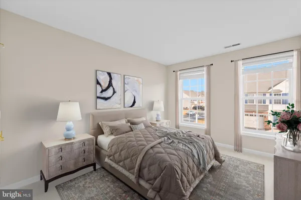 a bedroom with a bed and glass windows