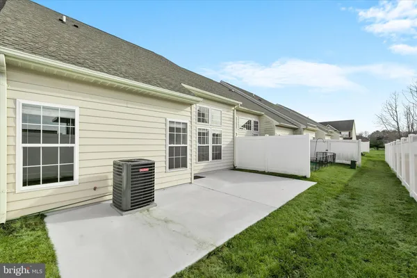 a view of house with backyard