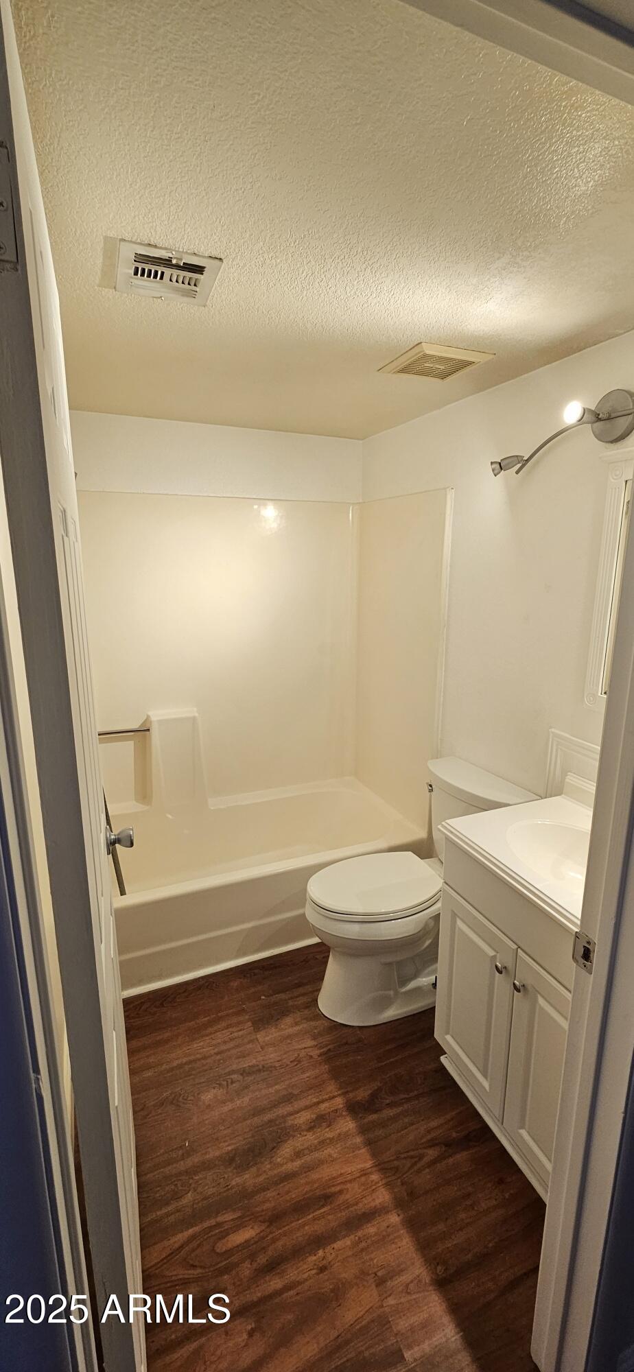 1245 West 1st Street, Unit 127 Tempe, AZ 85281 - Photo 12 of 15 a bathroom with a sink a toilet a tub and shower