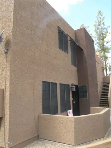 a view of a backyard with sitting area and furniture