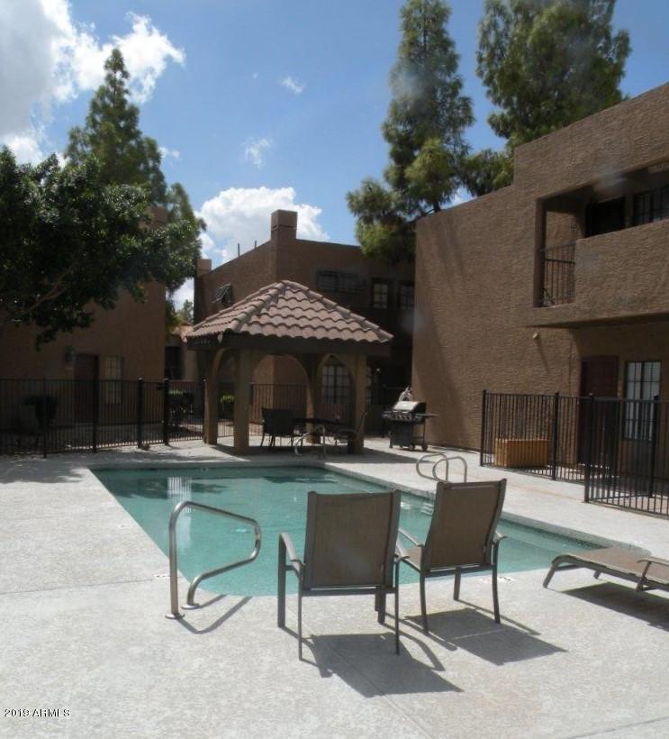 1245 West 1st Street, Unit 127 Tempe, AZ 85281 - Photo 15 of 15 a view of a backyard with sitting area and furniture
