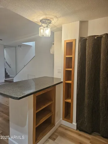 a room with cabinets and stainless steel appliances
