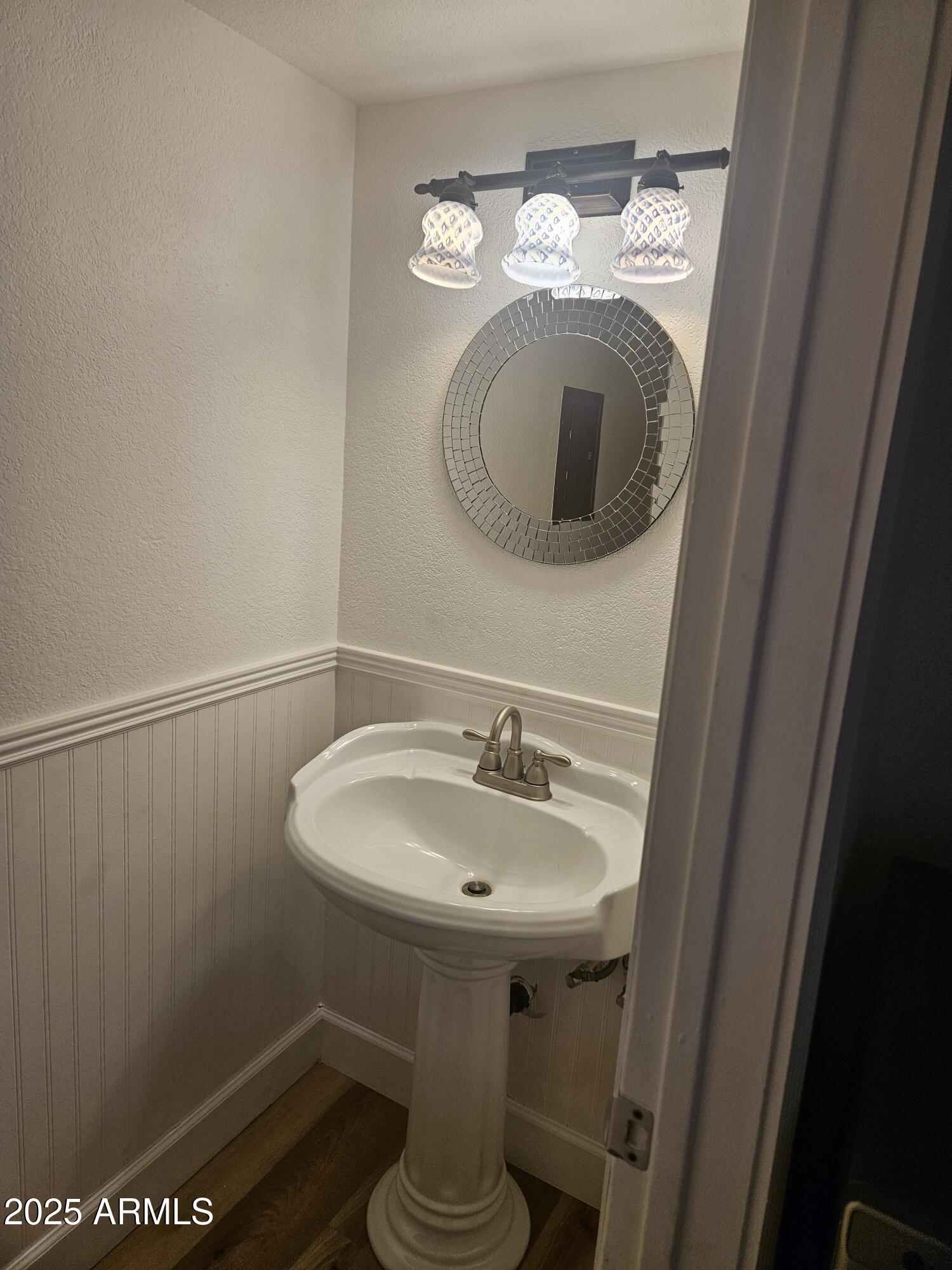 1245 West 1st Street, Unit 127 Tempe, AZ 85281 - Photo 5 of 15 a bathroom with a sink and a mirror