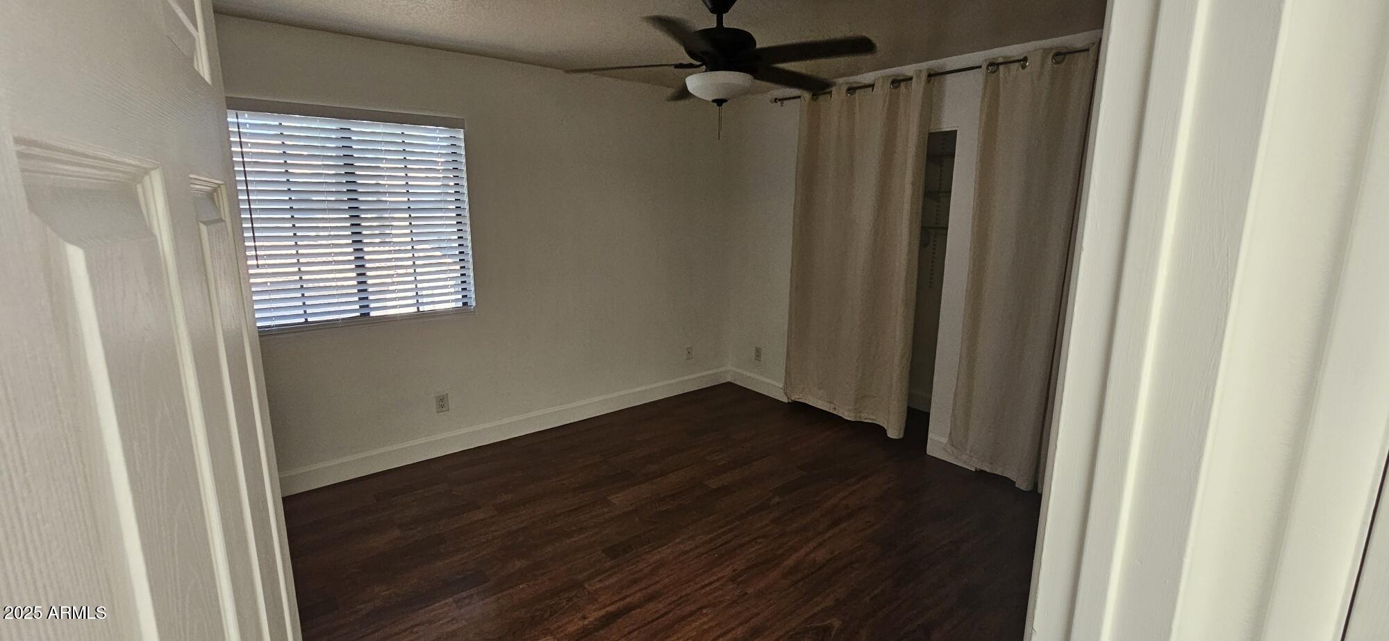 1245 West 1st Street, Unit 127 Tempe, AZ 85281 - Photo 9 of 15 a view of a room with wooden floor and a window
