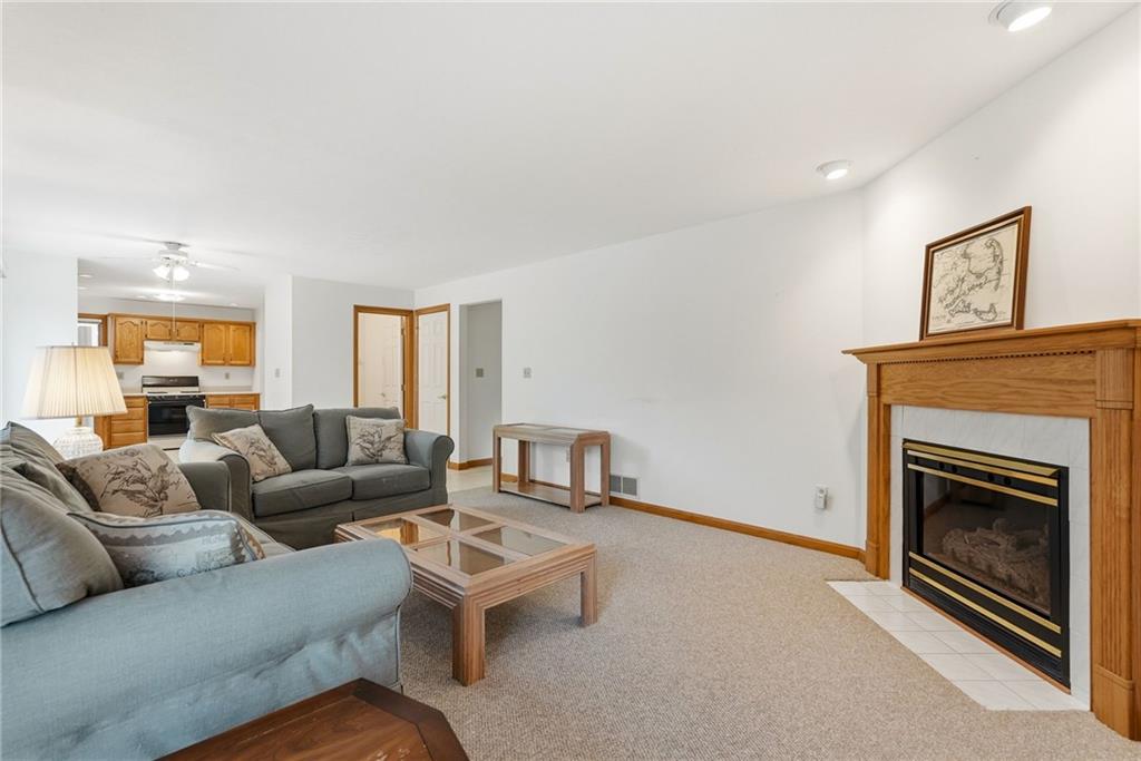 114 Sika Drive Pittsburgh, PA 15239 - Photo 20 of 45 a living room with furniture and a fireplace