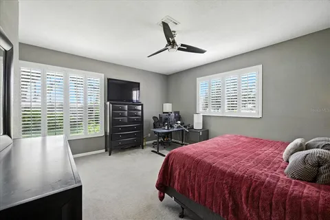 a bedroom with bed and a window