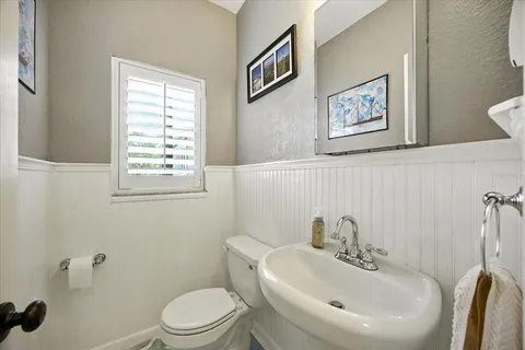 a bathroom with a sink a mirror and shower